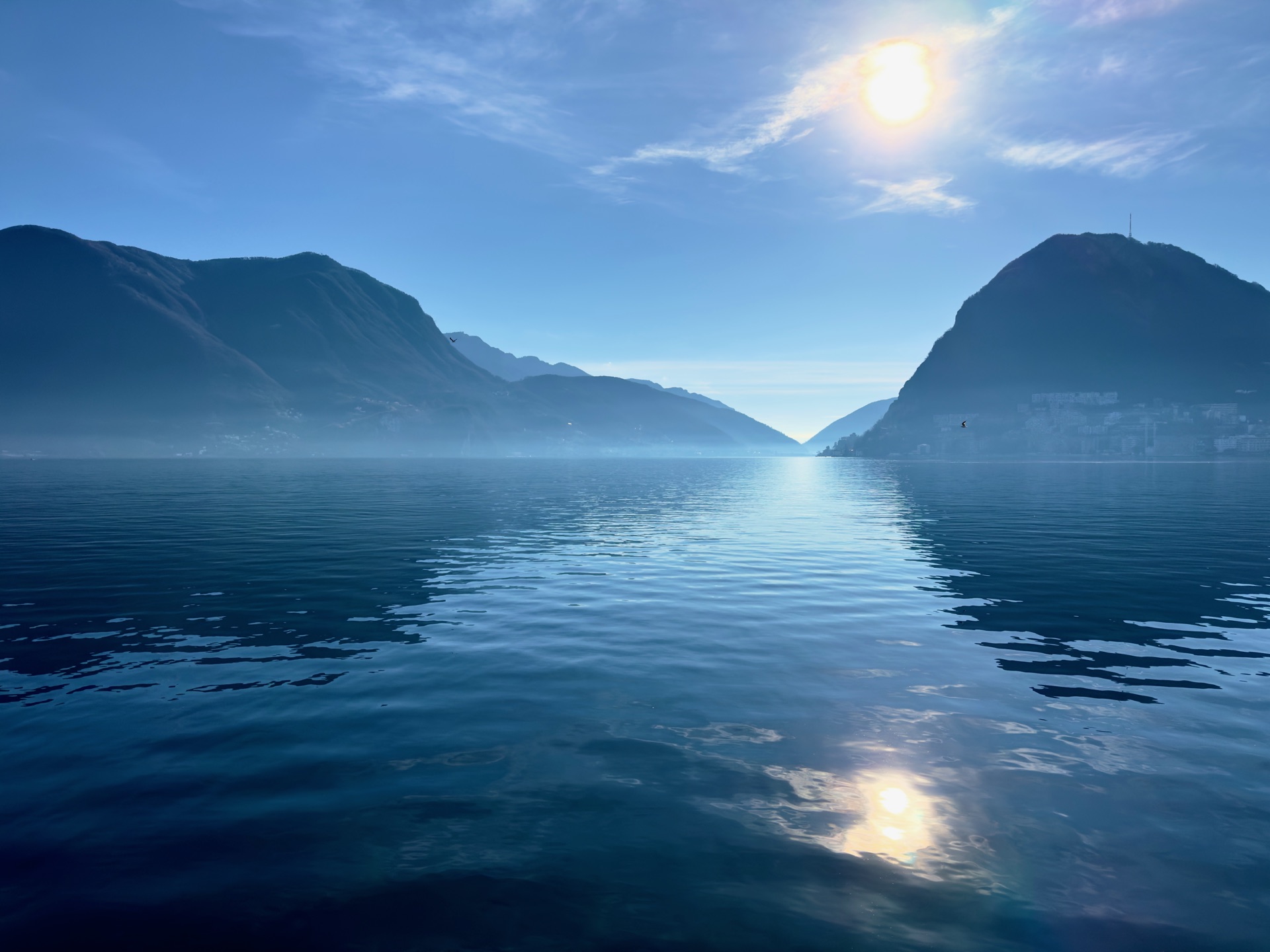 Original photo: a misty alpine lake between mountains.